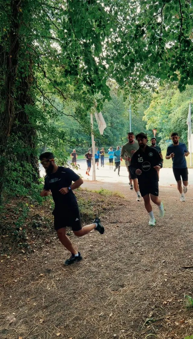 Runners on a woodland path