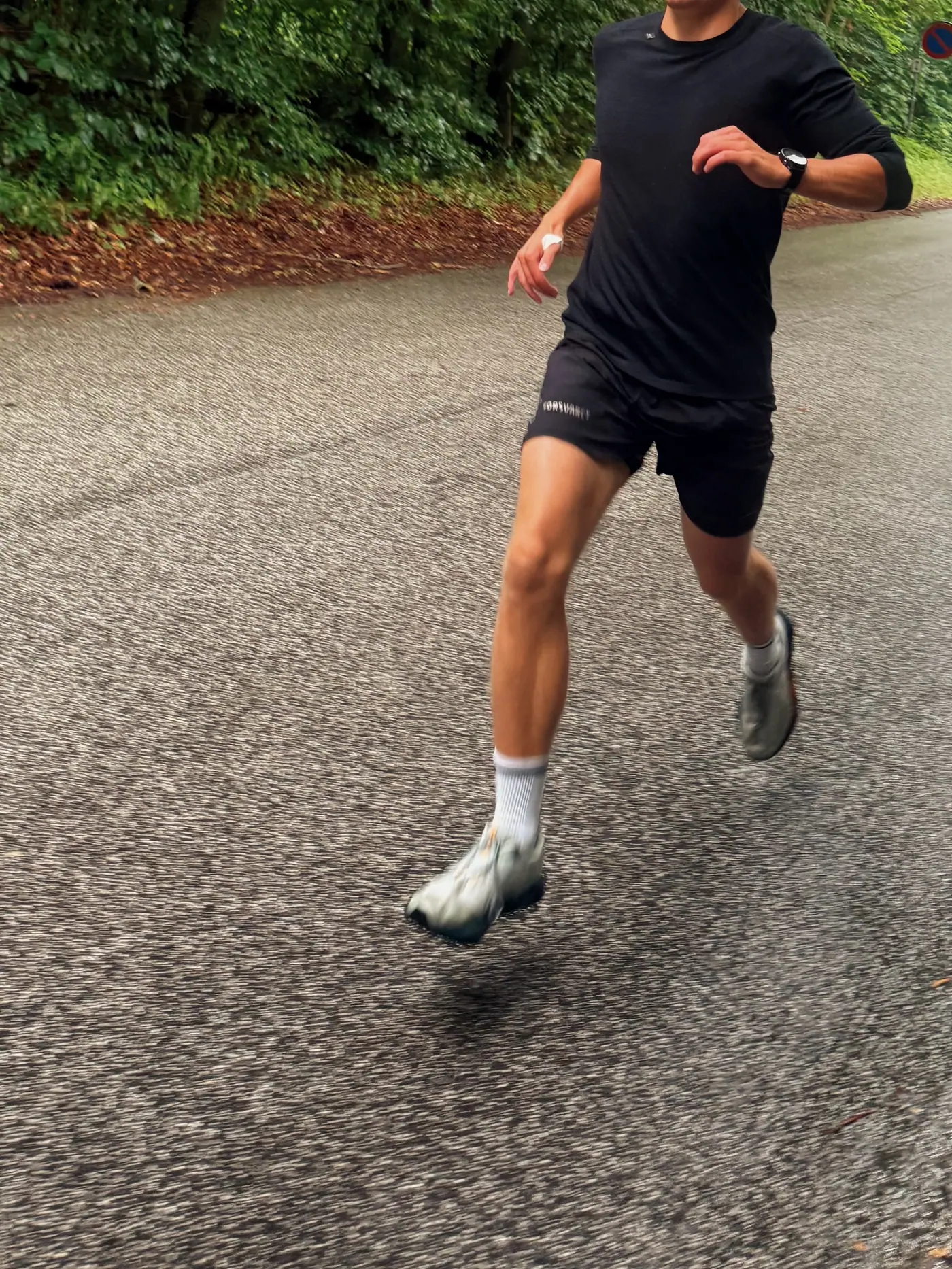 A runner on wet asphalt